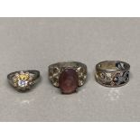 Three silver rings to include one white stone cluster 21.6g gross