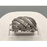 Ladies 18ct white gold diamond cluster ring. Comprising of baguette and round cut diamonds approx