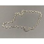 A heavy silver chain with heart shaped clasp 44.9g