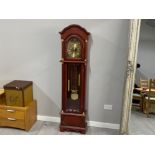 Reproduction mahogany framed grandfather clock with atlas design