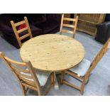 Circular topped pine kitchen table & 4 matching ladder back chairs