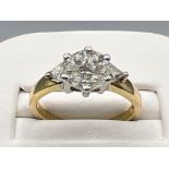 Ladies 18ct white gold diamond ring. Comprising of 3 marque cut diamond set with 2 round and