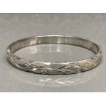 A silver engraved bangle stamped 925 23.9g