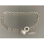 A heavy silver Albert chain necklace with heart shaped charm 53.6g