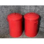 Two red painted metal dustbins