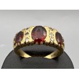 Vintage 18ct gold 3 stone garnet and diamond set ring. 7g size Q