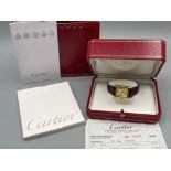 Original 2004 Cartier tank watch with original box and papers. Good working condition