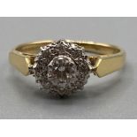 Birmingham 1978 18ct gold Diamond cluster ring, comprising of a centre round brilliant cut diamond