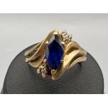 Ladies 10ct gold oval sapphire and white stone ring. 3.2g size N1/2