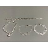 Four silver bracelets one with heart shaped charm 40.9g