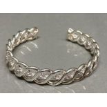 A silver torc style bangle 18.2g