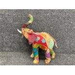 A large handmade patchwork elephant sculpture 20” high