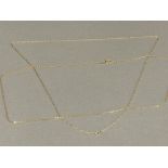 9ct yellow gold chain 0.7g, plus 1 other gilt metal chain