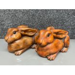 A pair of heavy pottery rabbits by Wildlife Studio Hexham