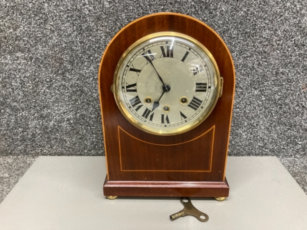 An Edwardian inlaid mahogany mantle clock with key