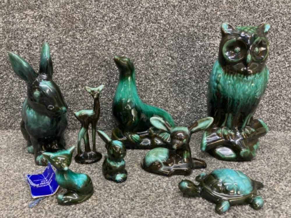 Eight pieces of Canadian Blue Mountain pottery animal figurines to include an owl and seal