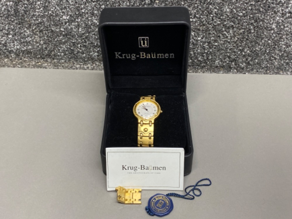 Krug-Baumen Charleston calendar wristwatch with white dial, gold coloured strap & original box