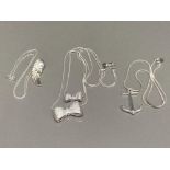 Three silver pendants of angel wing, ribbon and anchor designs, on silver chains 36.2g