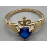 10ct gold brand new ex display Claddagh ring with blue heart shaped stone size N 1.7g gross