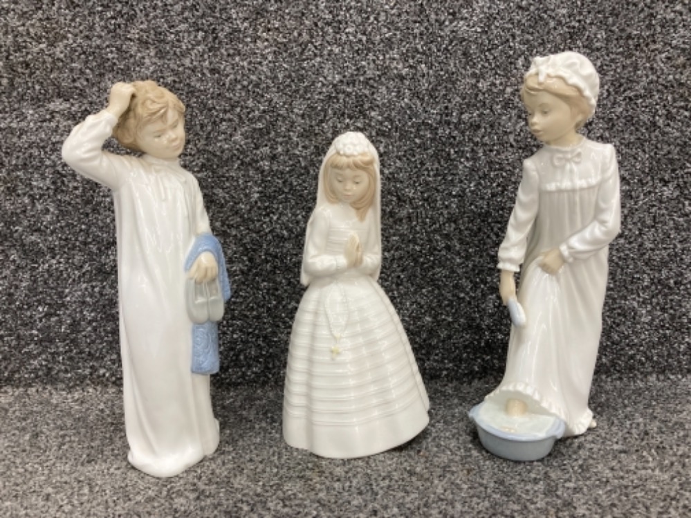 Three Nao by Lladro figures including communion (one with damage)