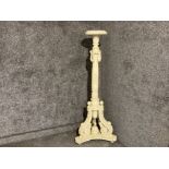 A cream painted carved wooden baroque style torchiere 146cm high