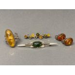 Silver and amber type jewellery to include a ring and brooches