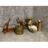 An antique brass watering can, copper and brass jug, carved wooden elephant stand etc