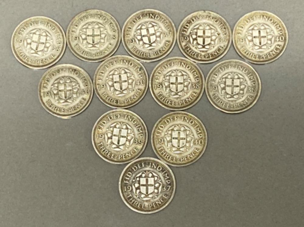 Total of 12 silver three pence coins dated 1937-1940 with reverse displaying a shield with Saint