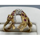 9ct yellow gold stone set panther ring, featuring a panther set with 8 rubys and 3 round brilliant