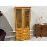 Pine double door display cabinet fitted with 4 drawers & glass shelves