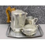 A three piece Picquot Ware tea set with associated tray.