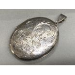 Hallmarked Birmingham silver 1966 large oval shaped locket (Nicely etched to front) 15.8g