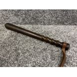 Dark hardwood Truncheon with grooved grip and embossed leather strap. Signed Hiatt & Co of