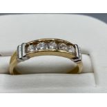 Ladies 9ct Yellow Gold cubic zirconia band, featuring 5 round stones chanel set across the ring, 2.