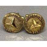 A pair of genuine gilt metal Mercedes Benz cufflinks