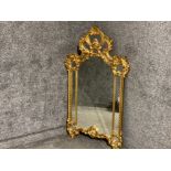 A rococo style wall mirror in ornate frame 130 x 78cm