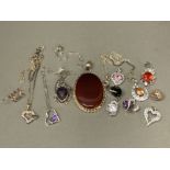 A collection of silver and coloured stone pendants, silver chains etc