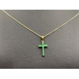 Ladies 9ct Yellow Gold emerald cross with chain, comprising of 12 round emerald stones with 9ct gold