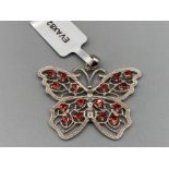 A silver and garnet butterfly pendant by Gemporia 5.7g gross with COA and slip