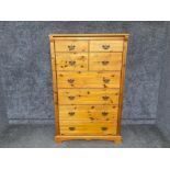 A pine chest of four single and four long drawers made in the UK 89.5 x 142 x 46cm