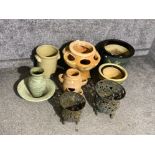 A various amount of garden plant pots to include ceramic and cast iron pots