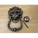 A reproduction cast metal 10 Downing Street knocker in the form of a lion