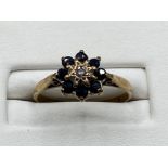 Ladies 9ct Yellow Gold sapphire and diamond cluster ring, featuring 8 blue sapphires and 1 diamond