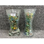 2 vases full of various size Marbles