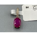 9ct gold ruby and zircon pendant by Gemporia .52g gross approx with COA and slip