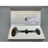 A tiger’s eye facial roller by Gemporia with COA