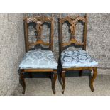 2 oak carved back chairs