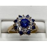 Ladies 9ct Yellow Gold blue and white stone cluster ring, comprising of 9 blie stones and 8 cubic