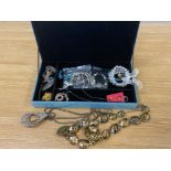 Blue glass jewellery box containing miscellaneous vintage costume jewellery pieces including