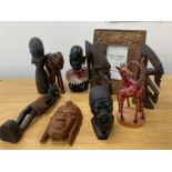 Box lot containing miscellaneous african & tribal carvings including giraffes, elephant, busts &